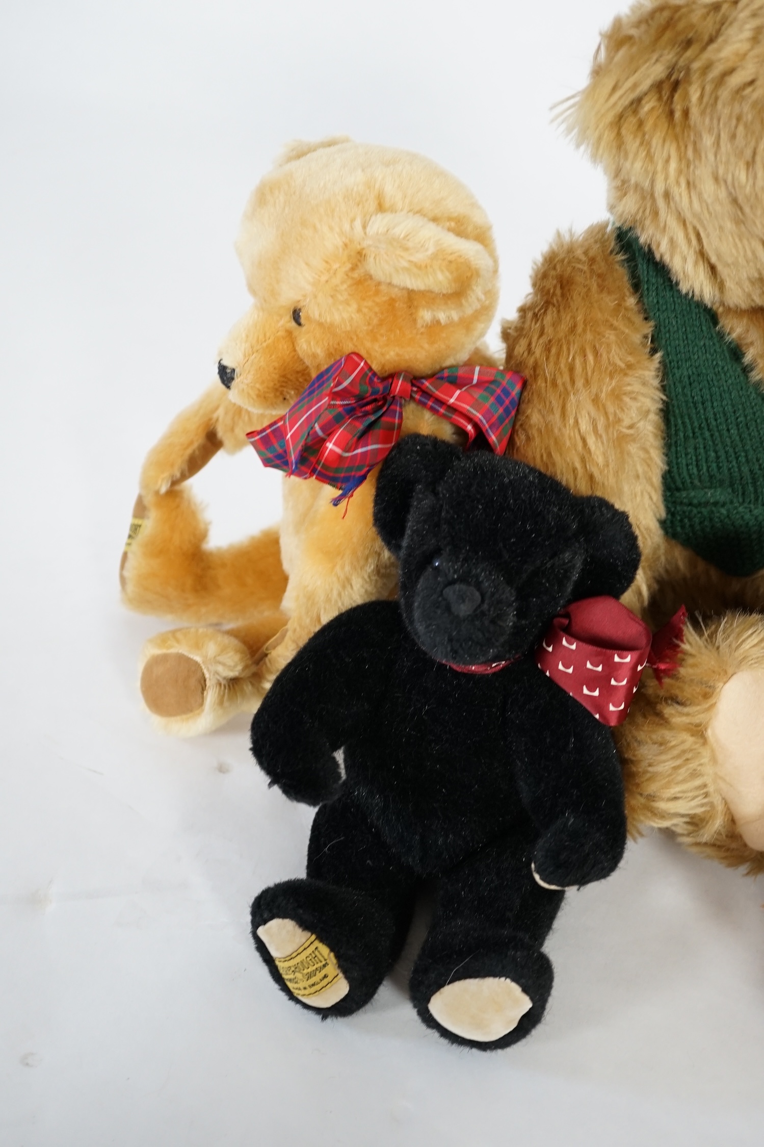 A large 1906 Steiff orange label, two Merrythought John Lewis bears, a black Merrythought bear, an artist bear and a Merrythought Alfred bear (6)